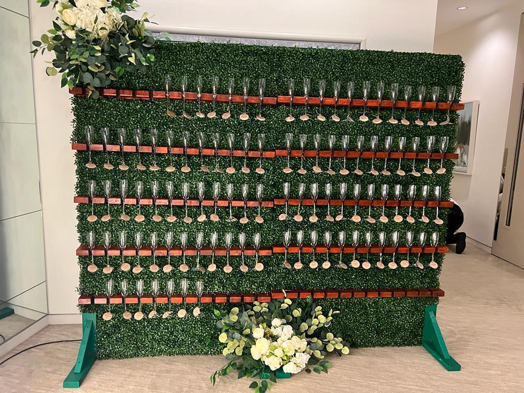 Elegance in Bloom: Champagne Wall with Flowers Hire