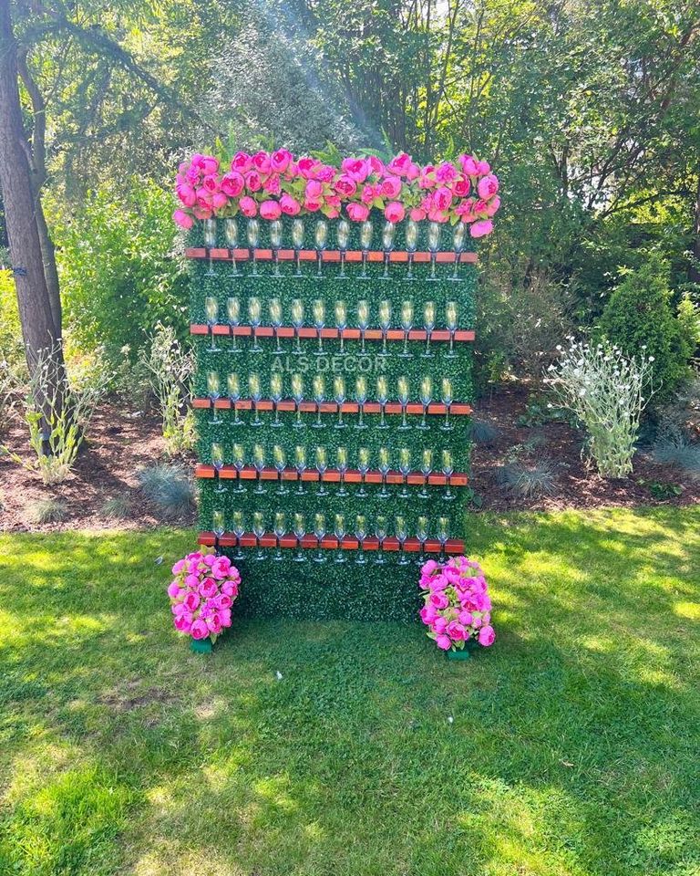 Elegance in Bloom: Champagne Wall with Pink Flowers Hire